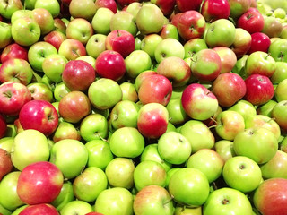 Many fruits green apples lying at supermarket