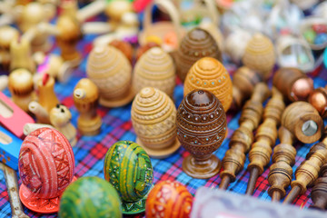 Small wooden toys, Easter eggs and decorations sold on Easter market in Vilnius