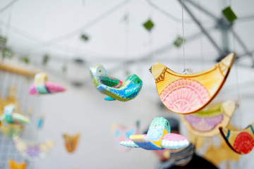 Cute colorful wooden birds sold on Easter market in Vilnius.