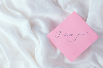 A pink sheet of paper with the words 