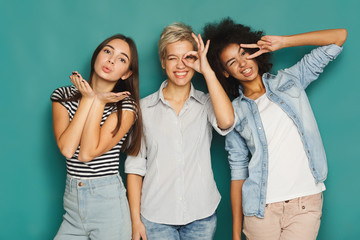 Happy friends having fun at blue background