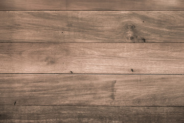 Plain horizontal pale brown coloured wood background.