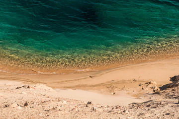 Soft waves of clear sea on sandy beach in the Ras Muhammad National Park.