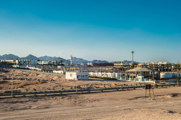 Fragment of the city of Sharm El Sheikh on the background of the Sinai mountains at sunset