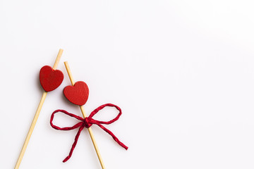 Three handmade heart cupcake toppers on white background