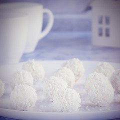 Delicious coconut candy on a white plate.