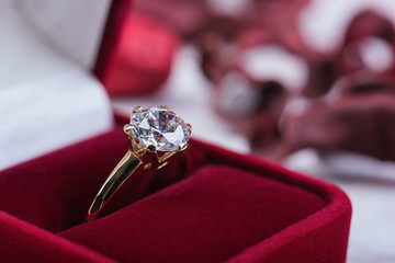 Diamond wedding ring in a red gift box