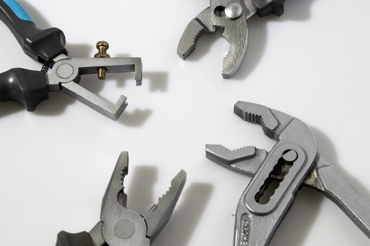 Blue flat-nose pliers in a white background composition