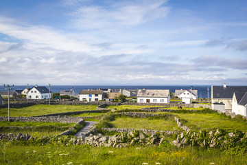 Fototapeta na wymiar Houses and Stone Walls on the Aran Island of Inisheer, County Galway, in the West of Ireland