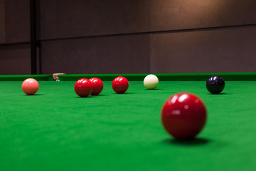 Snooker balls on the table at snooker club.