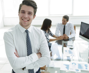 successful businessman on background of office.