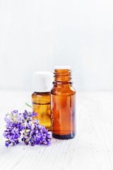 Obraz na płótnie Canvas lavender essential oil with lavender on white background.