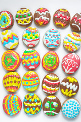 A lot of easter eggs on a white background. Cookies in the form of Easter eggs. Assorted. Flat lay