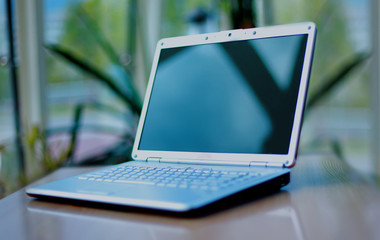 Fototapeta premium thin laptop on office desk.