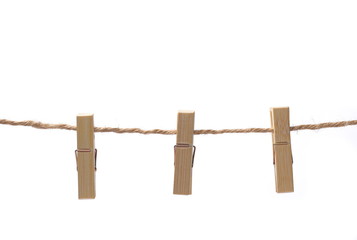 wooden clothespins, bamboo peg on rope isolated on white background, clipping path 