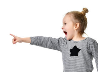 Young girl kid surprised yelling shouting pointing finger at the corner