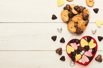 Lovers day background with various sweets in craft cornets