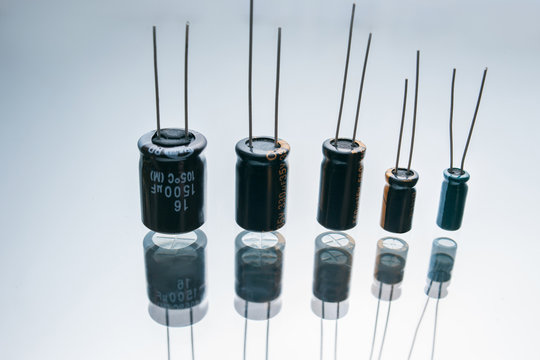 bipolar electric capacitors on white background. microelectronic component. construction of two electrodes