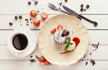 Chocolate fondant with vanilla ice cream and strawberry
