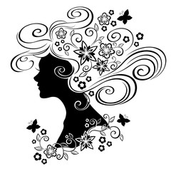 Silhouette of a girl with flowers in her hair