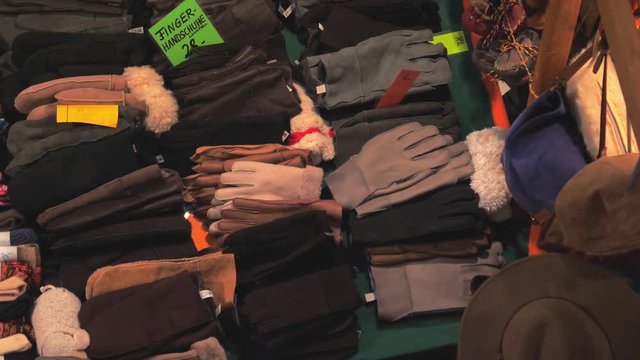 Leather goods market, warm fur and leather gloves, mittens, hats for sale