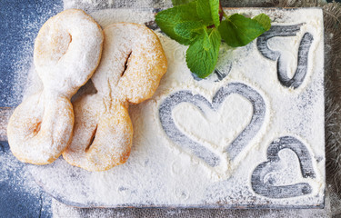 heart shape of flour and pastries on the table chefs