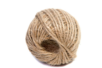 Skein of natural jute twine isolated on white.