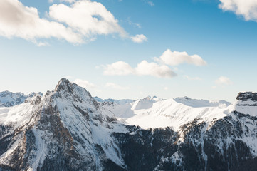 Snow-covered Dolomite Alps at winter sunny day, Val di Fassa ski resort, Italy