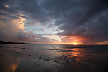 Fototapeta na wymiar Ocean Sunset with Blue Orange Clouds