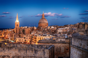 Fototapeta na wymiar Valletta, Malta: aerial view from city walls at sunset. The cathedral