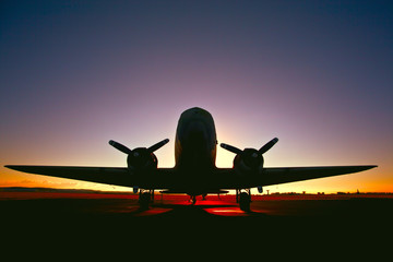 old world war two airplane at sunrise