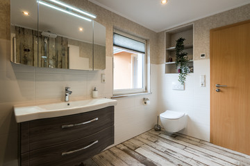 Fototapeta na wymiar Modern bathroom in vintage style with toilet horizontal shot