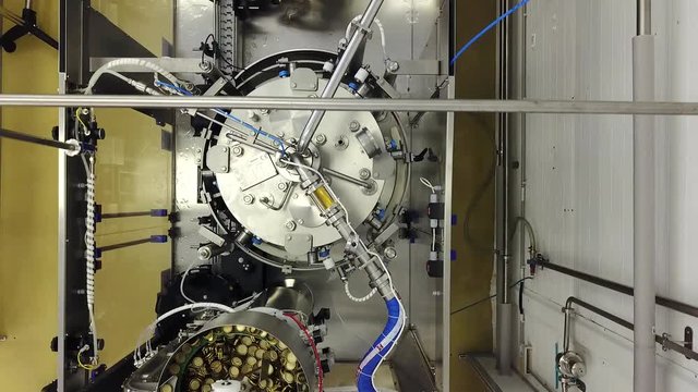 Automatic Beer Bottling Line at the craft Brewery.  Shooting with drone.