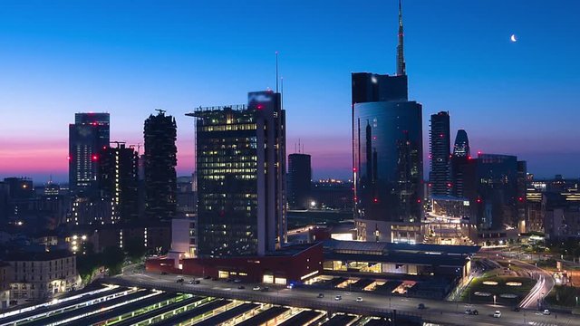 milan skyscrapers timelapse from night to day zoom out