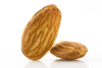 Almond nuts close-up isolated on white background. Healthy food, nutrition and diet.