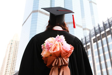 Female graduate with a bouquet of flowers