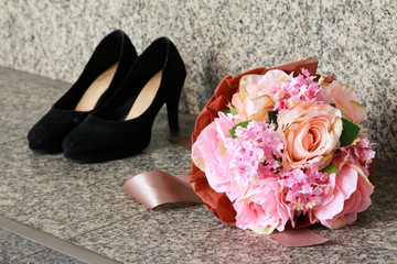 Flowers Gift Bouquet with blur high-heels background on floor