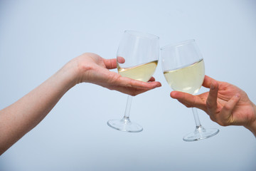 two glasses of champagne in women's hands.