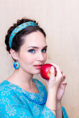 girl in a blue dress with Apple in the Palm of your hand.