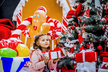 Cute baby posing at the Christmas tree