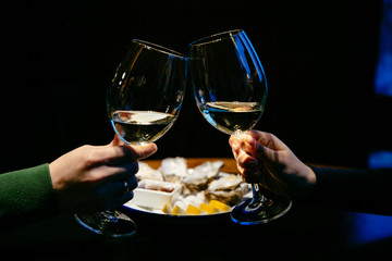 Hands with glasses of champagne. Concept of St. Valentine's day. Close-up.