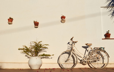 White bycicle against a white wall