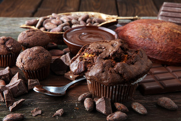 Chocolate muffins, homemade bakery on wooden background