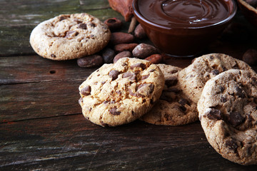 Chocolate cookies on wooden table. Chocolate chip cookies shot.