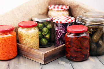 Jars with variety of pickled vegetables. Preserved food