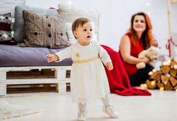 Sweet parents with daughter in the hall