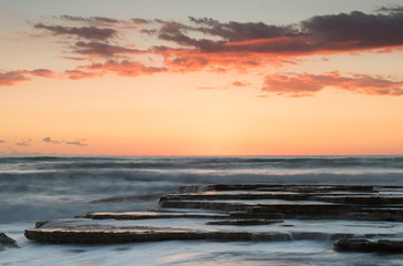 Beautiful dramatic Sunset over a rocky coast