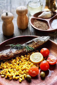 fried fish with corn and vegetables