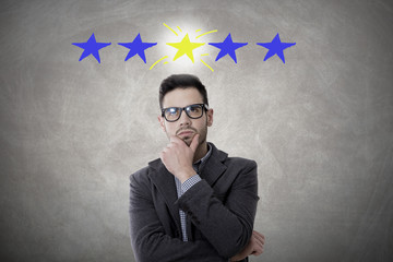 thoughtful businessman with stars, concept of success and leadership