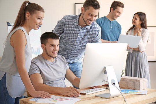 Group of young professionals having meeting in office